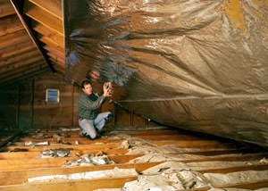 A radiant barrier installed in a Lexington attic